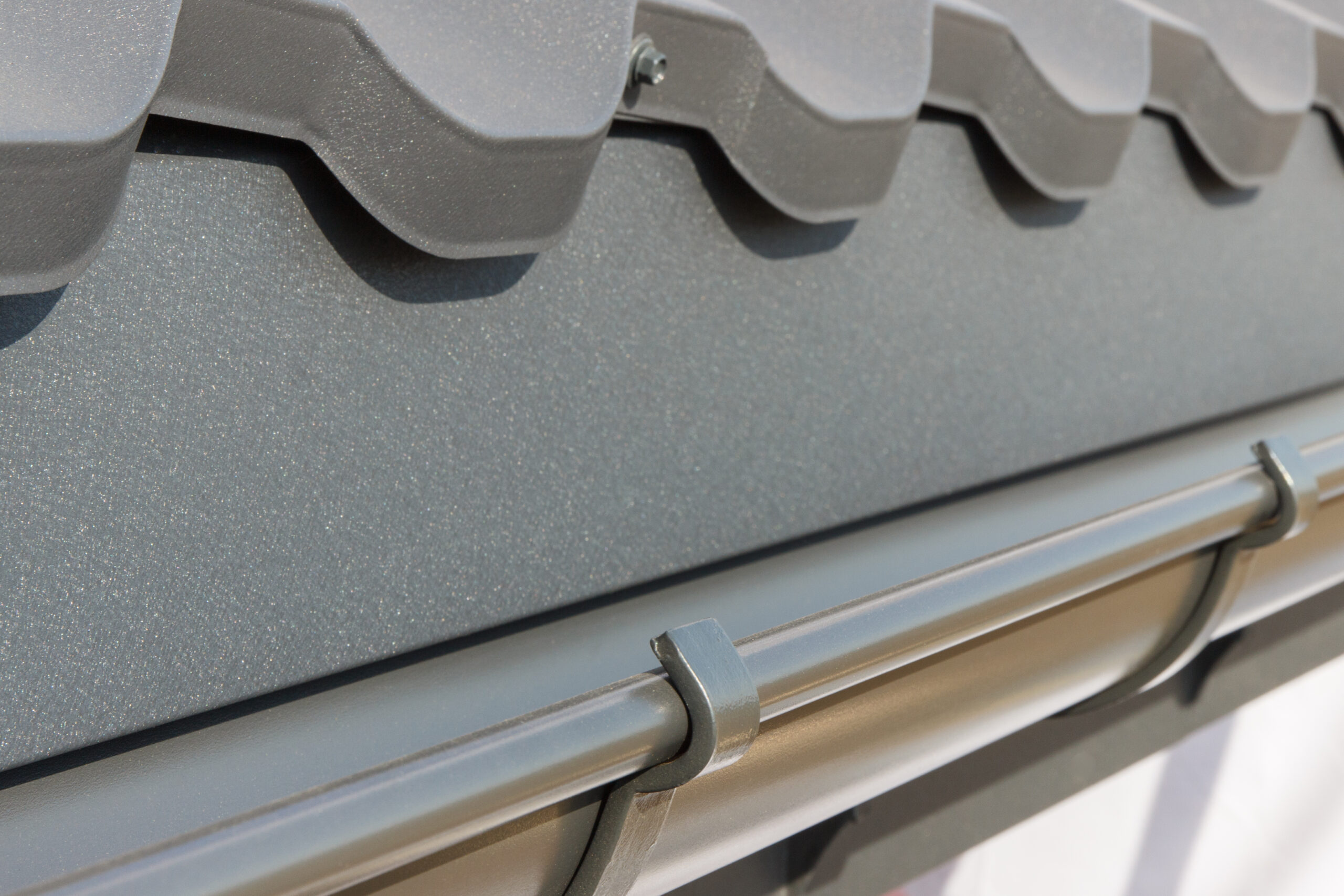 close-up-of-gray-metal-rain-gutter-system-2026-03-26-08-31-57-utc